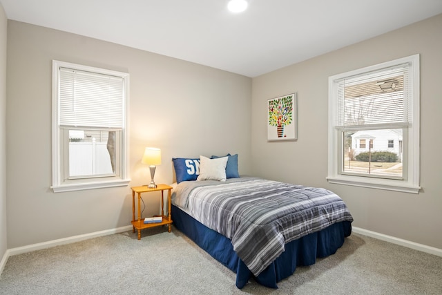 bedroom with baseboards and carpet flooring