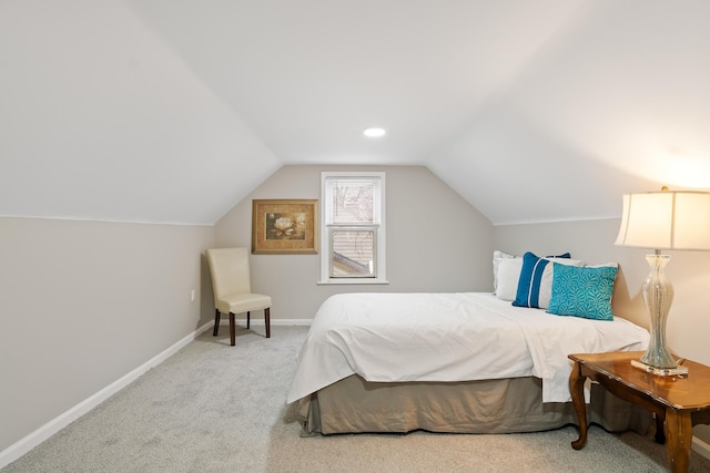 bedroom featuring vaulted ceiling, carpet flooring, and baseboards