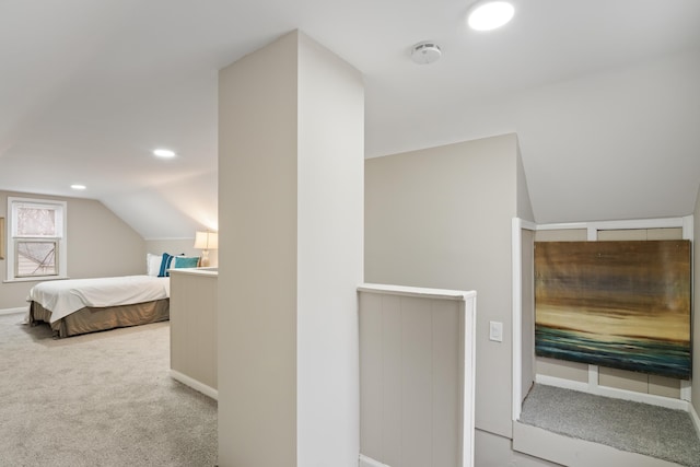 interior space featuring recessed lighting, lofted ceiling, and carpet flooring