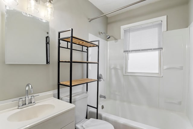 full bathroom with vanity, bathtub / shower combination, and toilet