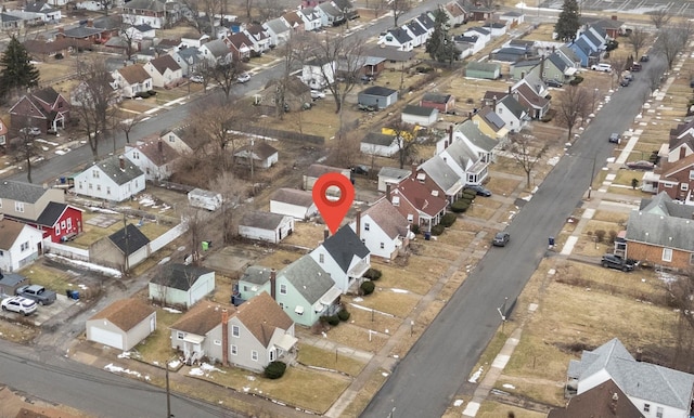 birds eye view of property with a residential view