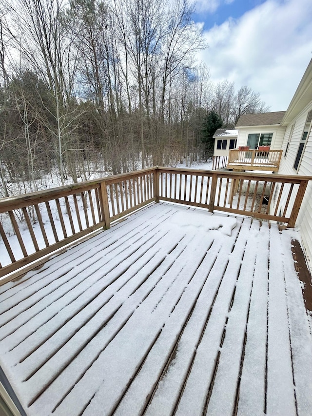 view of snow covered deck