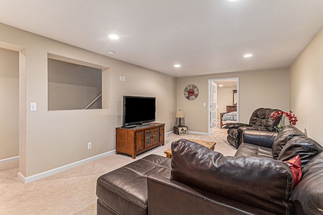 living room featuring recessed lighting, baseboards, and light colored carpet