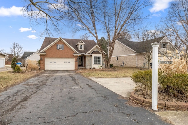 view of front of house featuring brick siding and driveway