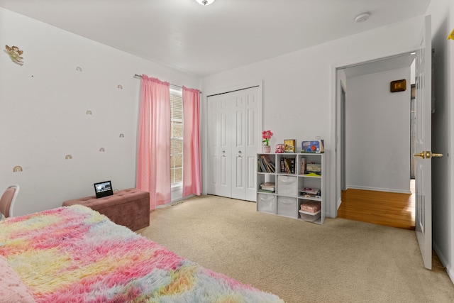 carpeted bedroom with a closet