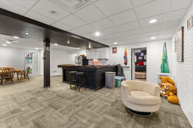 bar with a paneled ceiling, recessed lighting, freestanding refrigerator, light carpet, and a bar