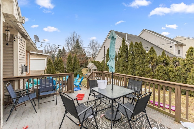 wooden terrace featuring outdoor dining area