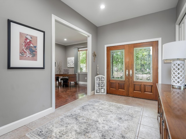 foyer featuring recessed lighting, french doors, baseboards, and light tile patterned floors