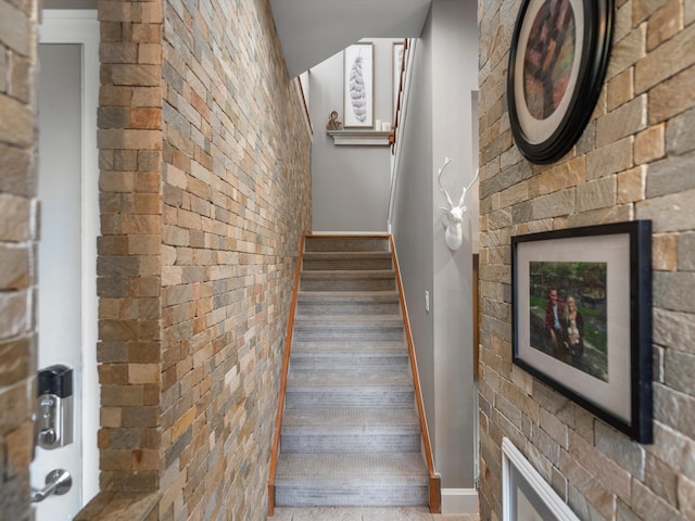 stairway with brick wall