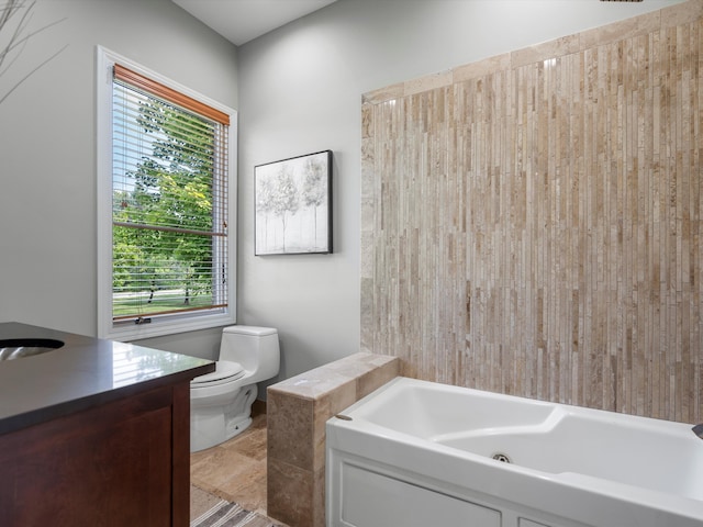 full bathroom with a tub to relax in, vanity, and toilet