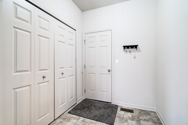 entryway with visible vents and baseboards