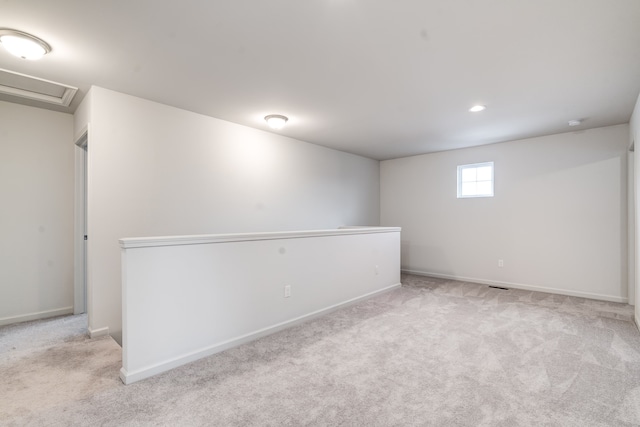 basement featuring carpet floors and baseboards