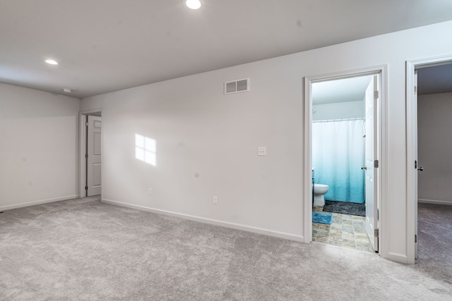 unfurnished room with recessed lighting, carpet, visible vents, and baseboards