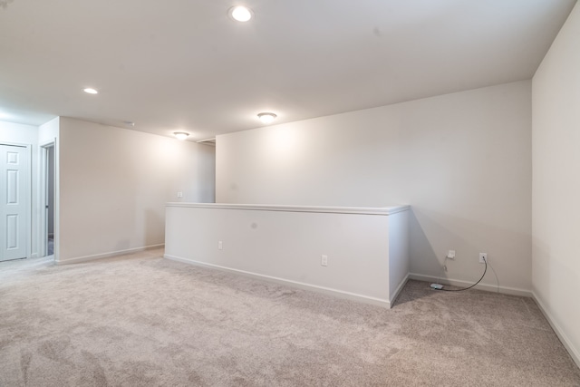 carpeted spare room with baseboards and recessed lighting