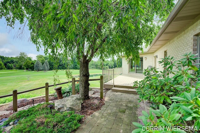 exterior space with a yard, a patio, and fence