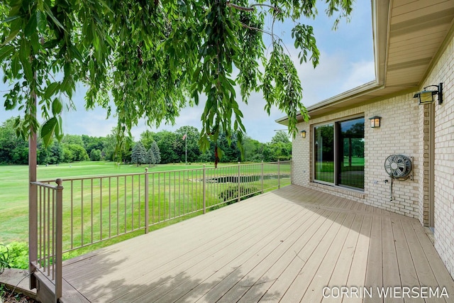 wooden terrace with a yard