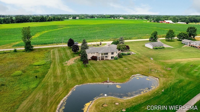 birds eye view of property with a rural view and a water view