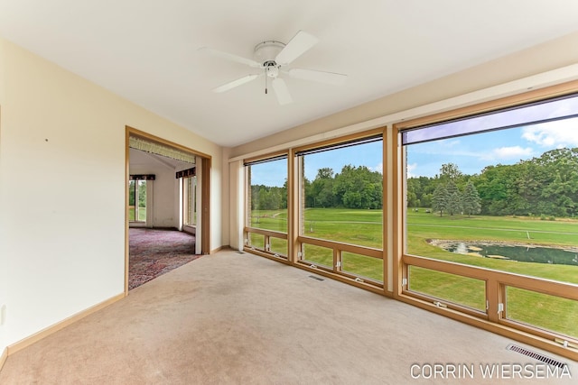 unfurnished sunroom with ceiling fan and visible vents