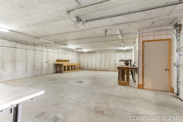 parking deck featuring a garage door opener