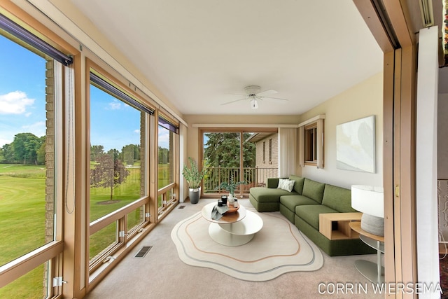 sunroom featuring ceiling fan and visible vents