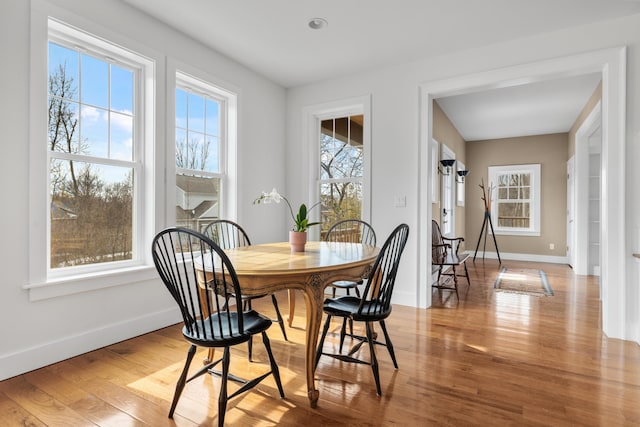 dining area with wood finished floors and baseboards