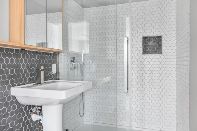 bathroom with backsplash and tile walls