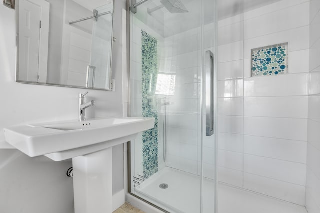 bathroom featuring a shower stall