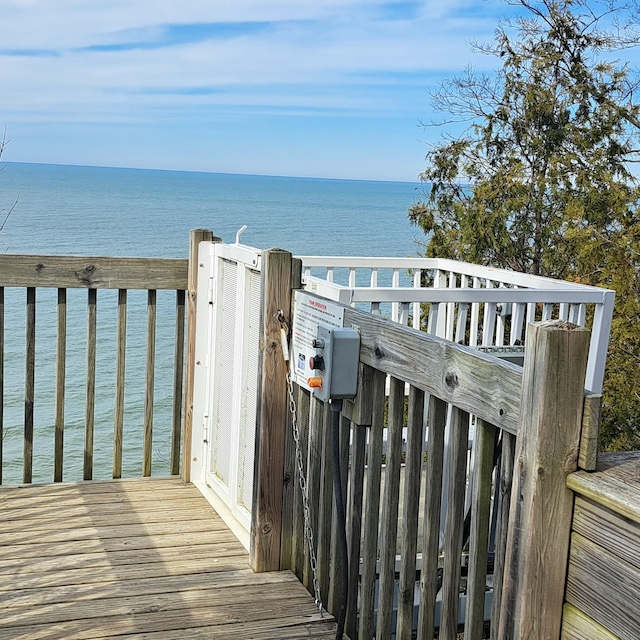 wooden terrace with a water view