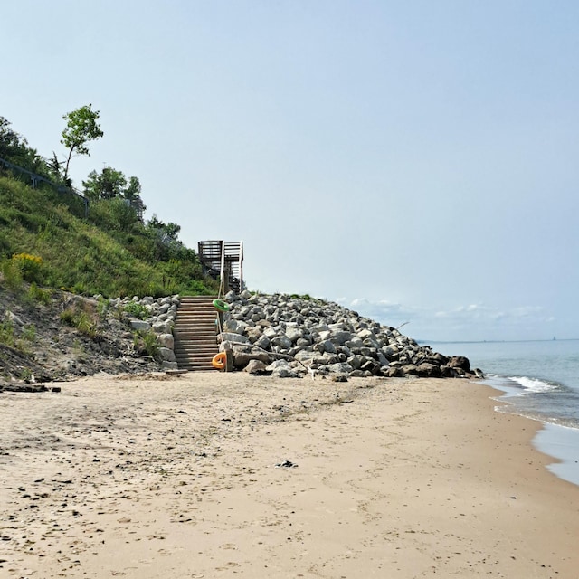 property view of water featuring a beach view