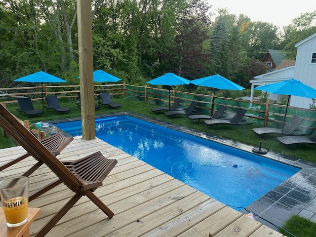 view of pool featuring a yard, a fenced backyard, and a fenced in pool