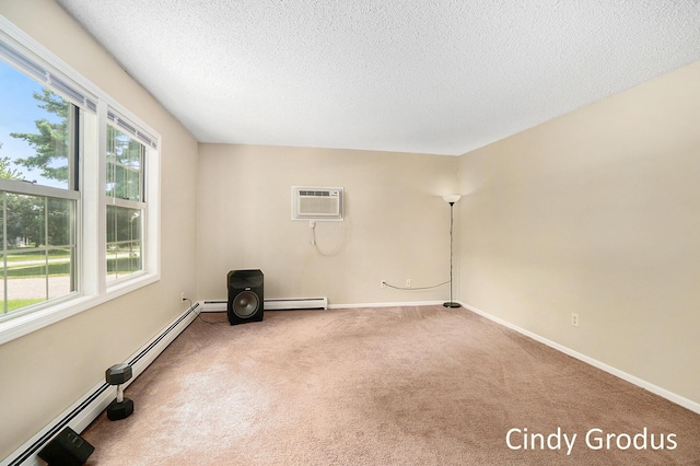 unfurnished room featuring a textured ceiling, a wall mounted AC, carpet, and a wealth of natural light