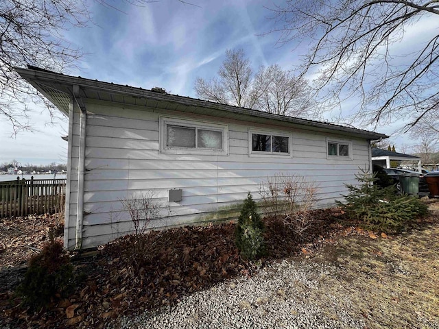 view of property exterior with fence