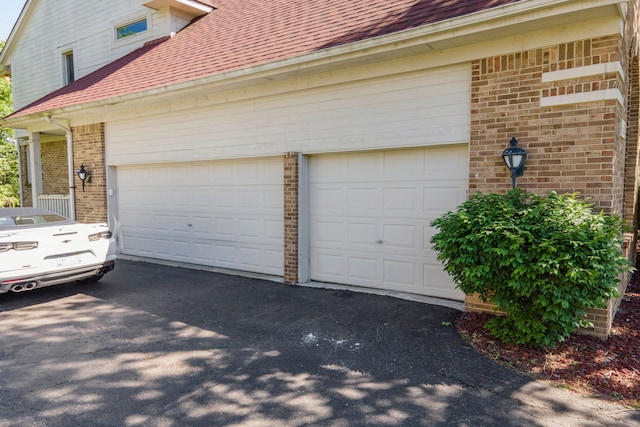 garage featuring driveway