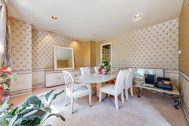 dining area with recessed lighting and wallpapered walls