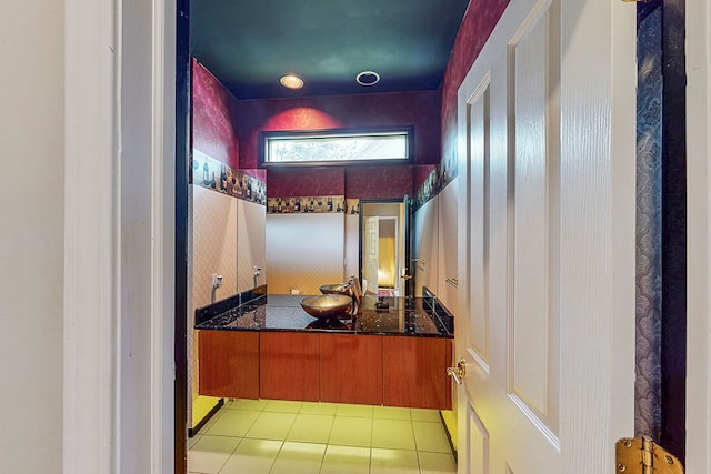 bathroom featuring tile patterned flooring and vanity