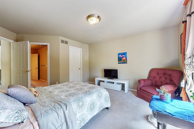 bedroom with carpet, visible vents, and baseboards