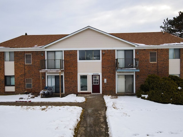 view of property featuring brick siding