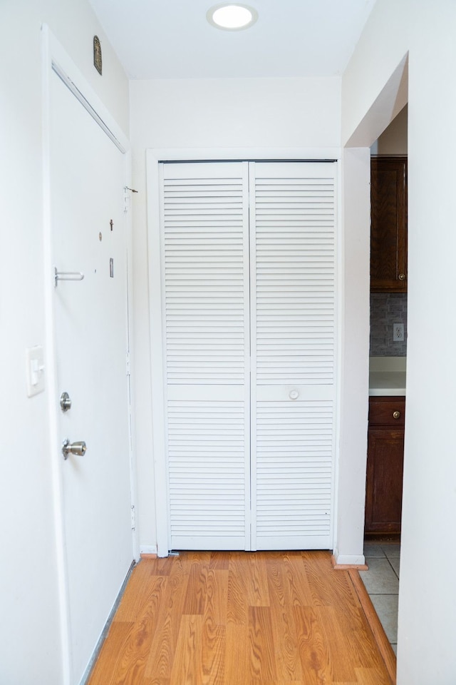 hall with light wood-style floors