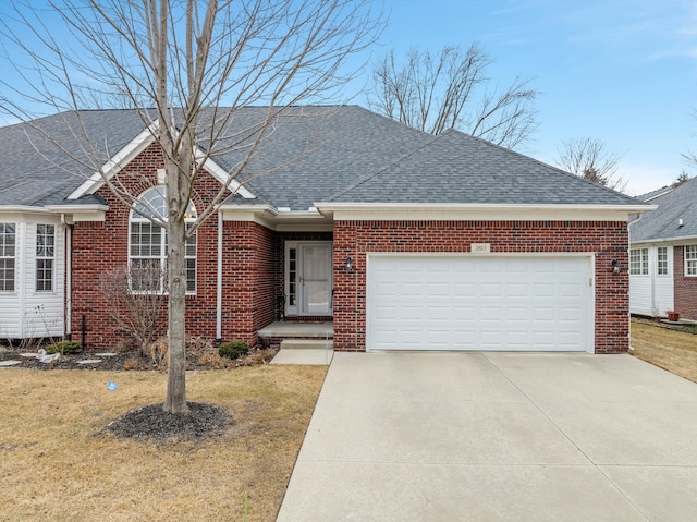 ranch-style house featuring roof with shingles, brick siding, an attached garage, driveway, and a front lawn