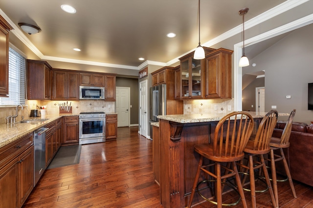 kitchen featuring dark wood-style floors, glass insert cabinets, appliances with stainless steel finishes, light stone counters, and a sink