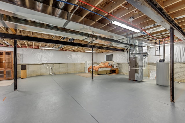 unfinished basement featuring gas water heater, brick wall, and heating unit