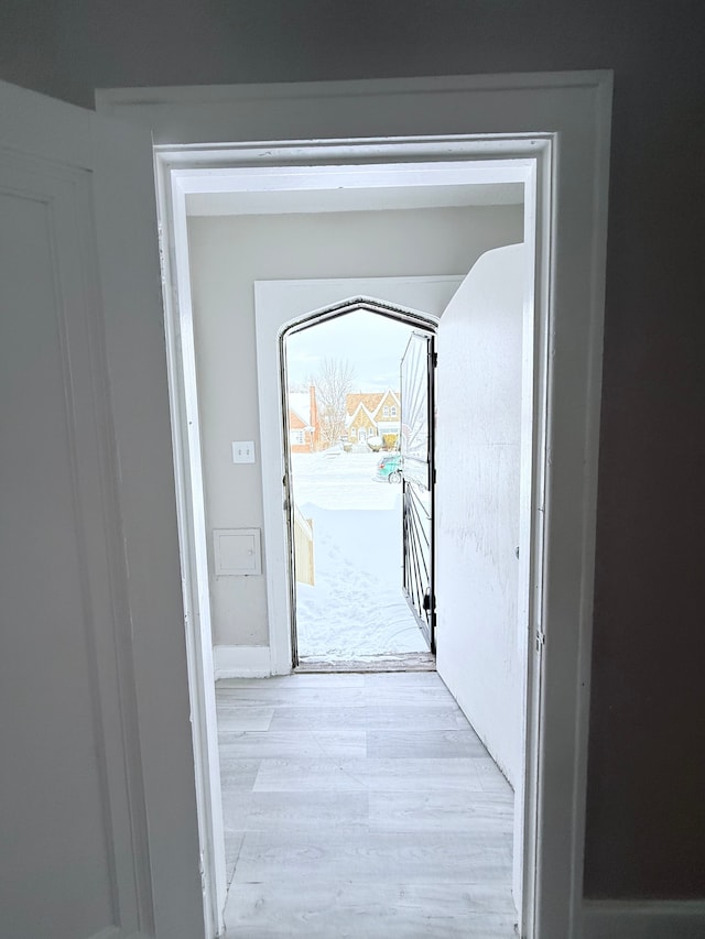 doorway with wood finished floors