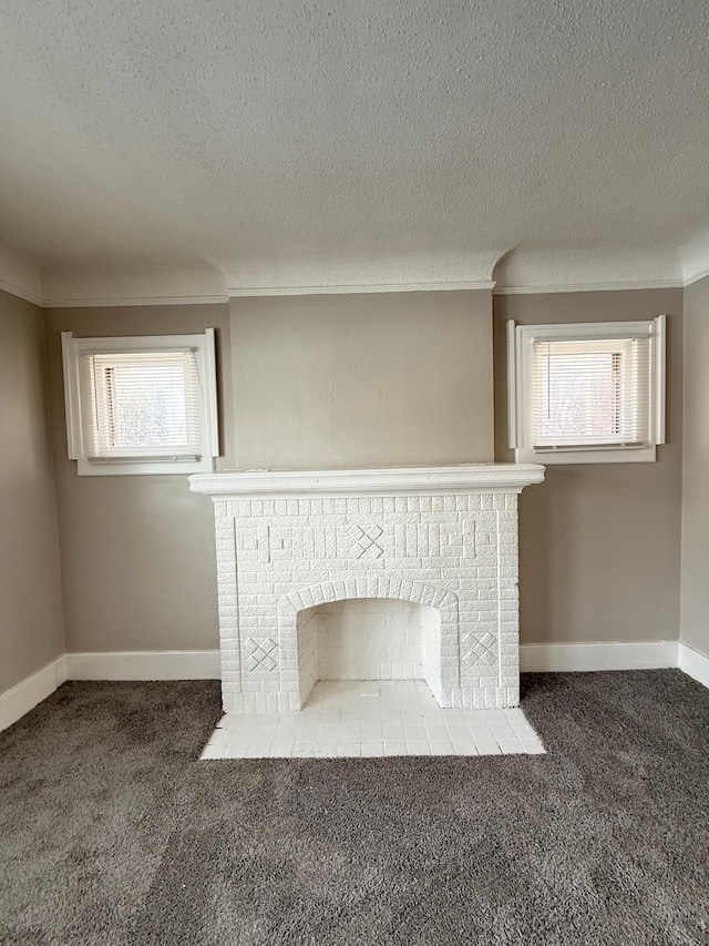 interior details with crown molding, a brick fireplace, carpet flooring, a textured ceiling, and baseboards