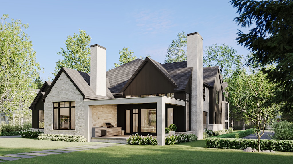 back of house featuring stone siding, a patio area, a chimney, and a lawn