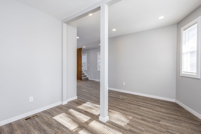 spare room featuring visible vents, baseboards, wood finished floors, and recessed lighting