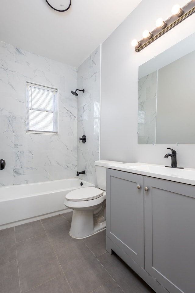 bathroom featuring toilet, shower / bathtub combination, and vanity