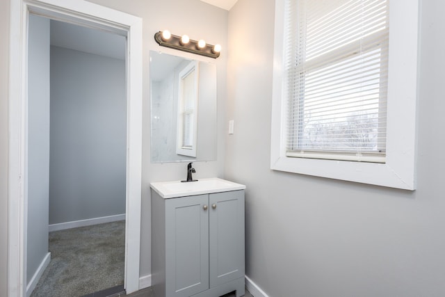 bathroom featuring vanity and baseboards