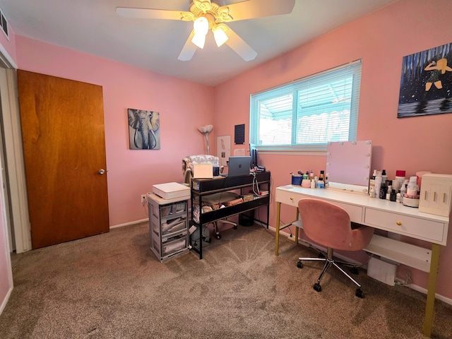 carpeted office with visible vents and ceiling fan