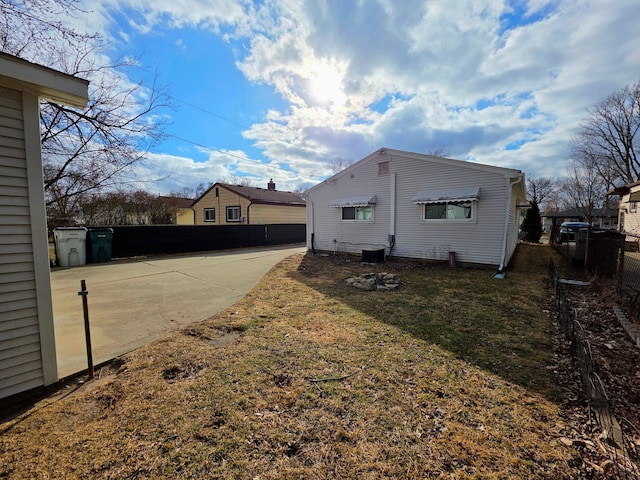 view of home's exterior featuring fence