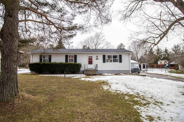 view of front of home with a lawn